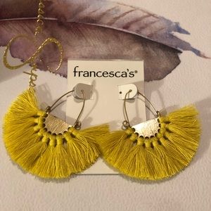 Yellow fan earrings.